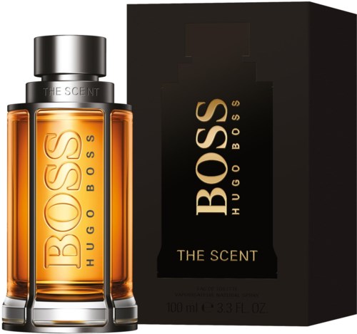 En Hugo Boss parfonglas och box med svart och guld märke, utsidan och insidan.