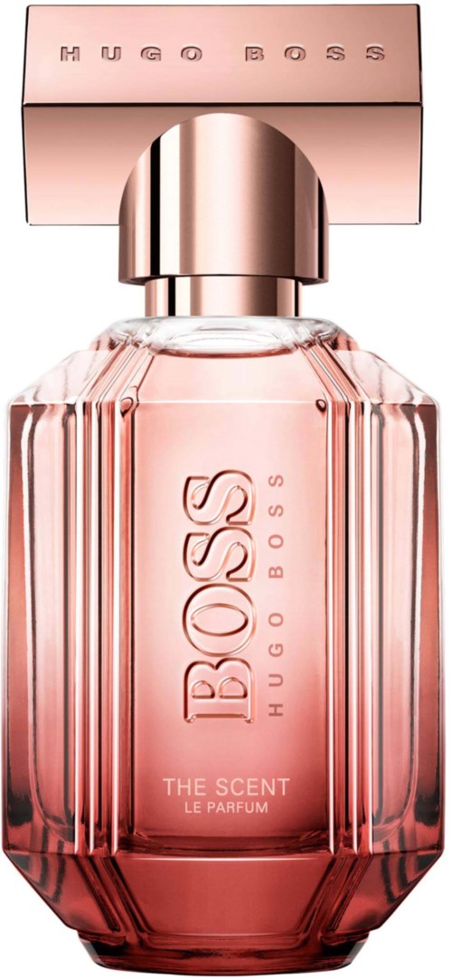 A pink perfume bottle with a silver cap and a pink box labeled 'Hugo Boss'.