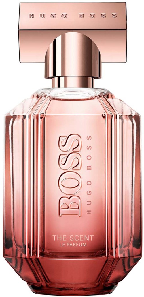 En rosa parfymeflaske med stor lokk, preget logo og rektangulær form. Teksten sier "Boss Hugo Boss" og "The Scent."