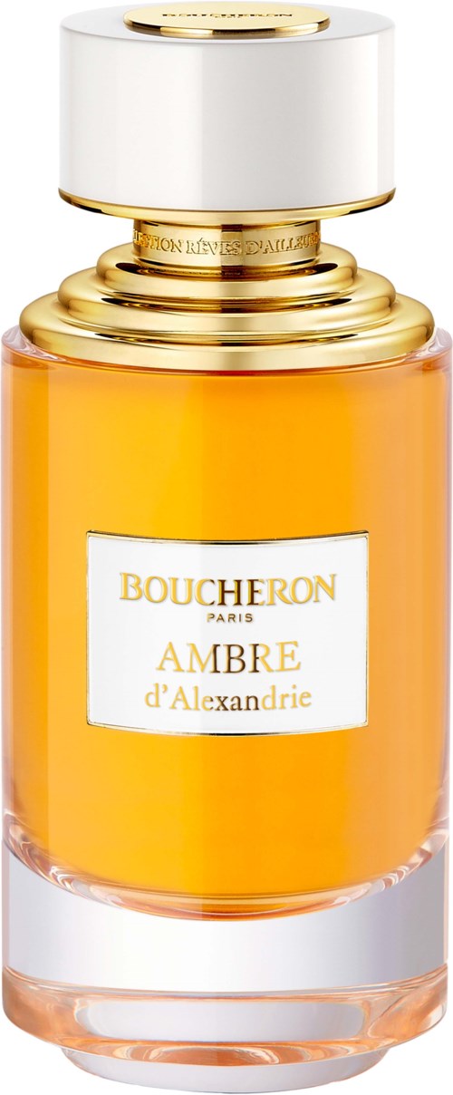 A perfume bottle with orange liquid, gold accents, and white cap labeled BOUCHERON Ambre d'Alexandrie.