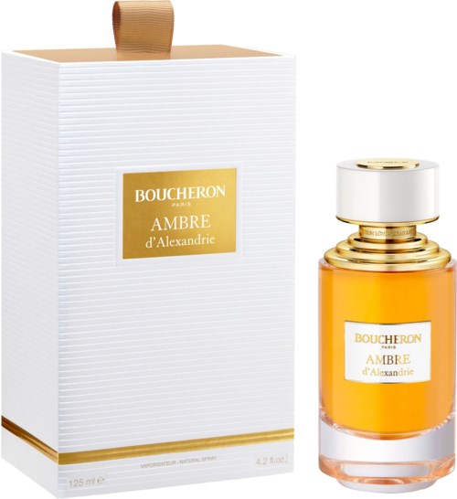 A perfume bottle and box with gold accents, labeled Boucheron Ambre d'Alexandrie, elegant and luxurious design.