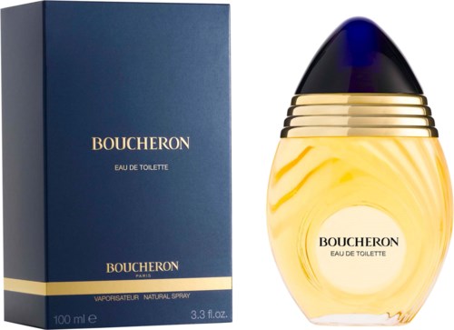 A perfume bottle with a yellow liquid, and a blue box with gold and white text. The bottle has a black top.