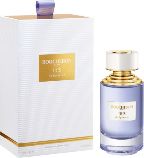A perfume bottle and box, both labeled Boucheron Iris de Syracuse, with gold accents and a purple liquid in the bottle.