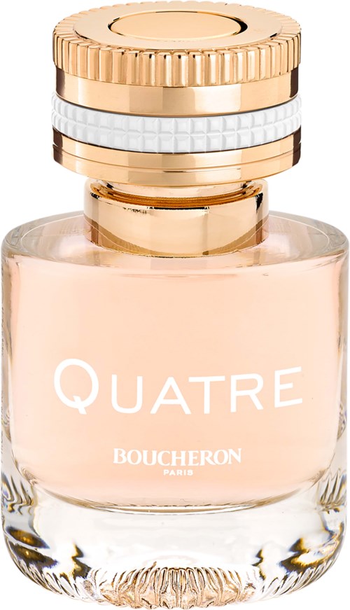 A perfume bottle with a gold and white striped cap, labeled 'QUATRE BOUCHERON PARIS', contains light pink liquid.