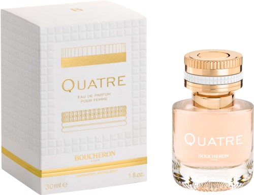 A perfume bottle with a pink liquid, gold and white cap, next to a white box with gold text and design.