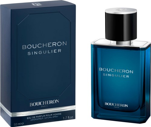 A blue perfume bottle with a black and silver cap next to its matching box, labeled Boucheron Singulier.