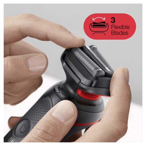 Electric shaver with 3 flexible blades and a red button, being held and adjusted by hands.