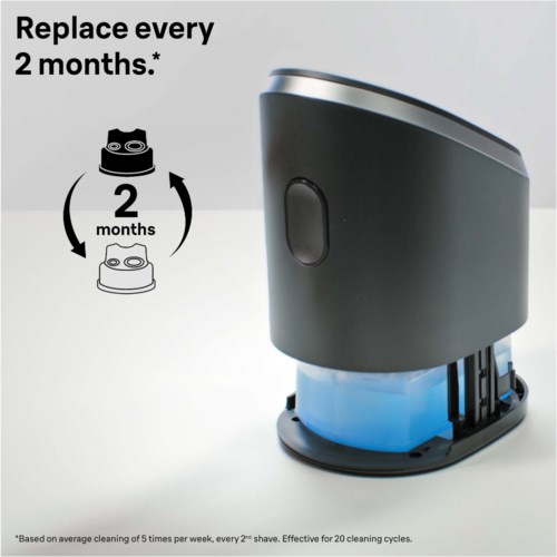 A device with a black and gray body, a round window, and a blue base, used for cleaning or shaving.