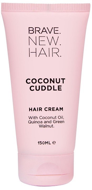 Hellrosa Tube mit Haarkreme, enthält Kokosnuss, Quinoa und grünen Walnuss. Text: 'Brave. New. Hair.' und 'Coconut Cuddle'.