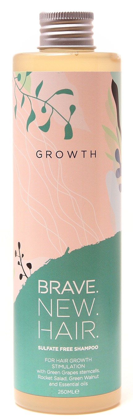 Eine Flasche Shampoo mit dem Aufdruck 'Brave. New. Hair.' für Haar wachsen, sulfatfrei, mit grünen und rosa Farben und Pflanzenillustrationen.