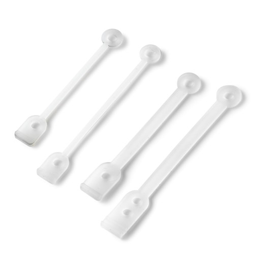 Four white plastic pull tabs, likely for packaging or bottles, with rounded ends and flat bases.