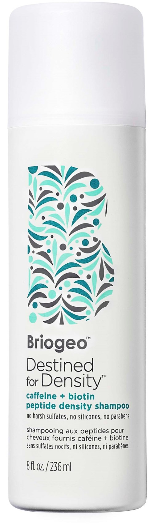A white bottle of briogeo shampoo with a colorful pattern and black text detailing ingredients and usage.