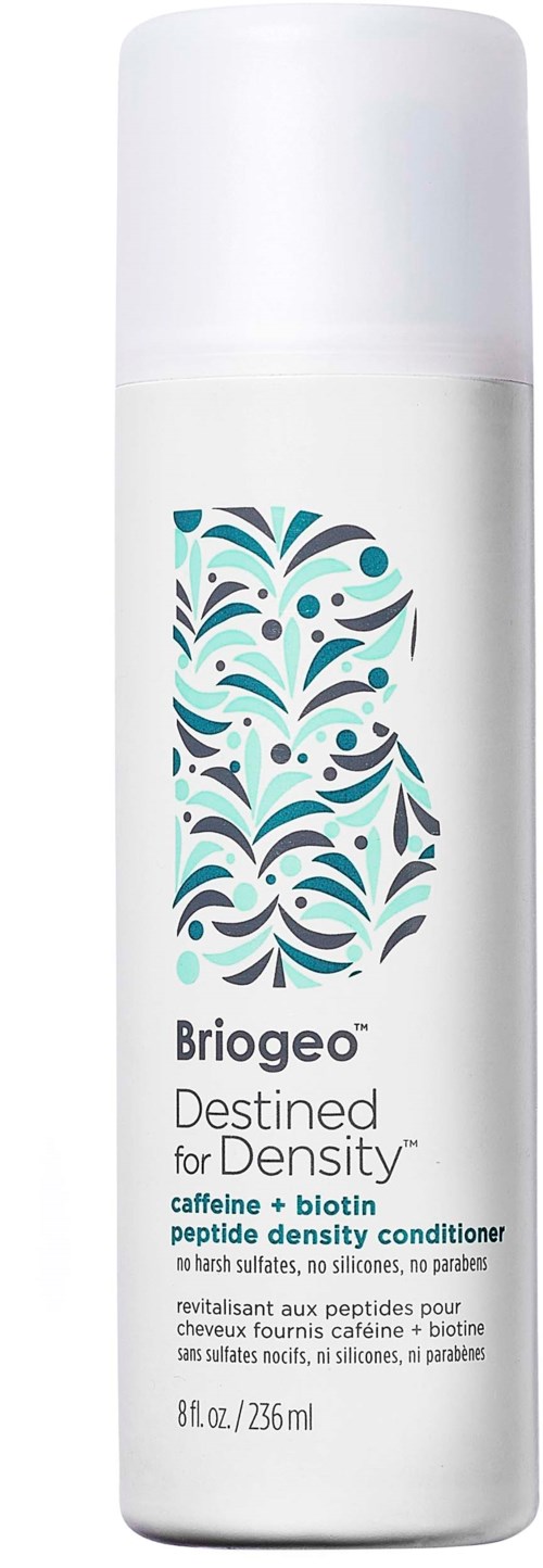 Eine weiße Flasche mit einem bunten abstrakten Muster, beschriftet 'Briogeo Destiny for Density' Koffein und Biotin Conditioner.