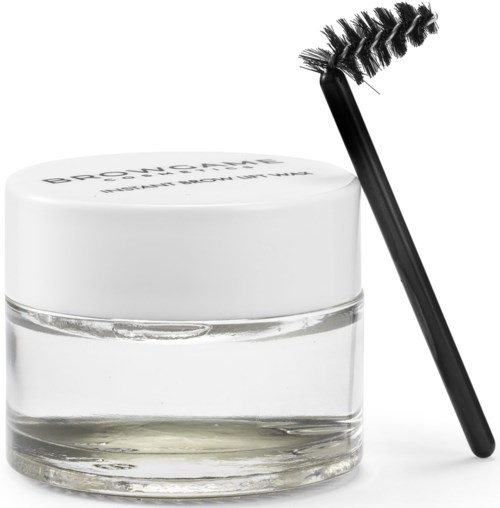 A clear jar of eye gel with a black mascara wand next to it.