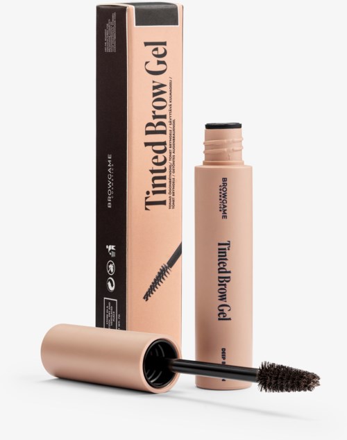A brow gel product in a pink tube with a black cap and a mascara-style wand. The box is also pink with black and text.