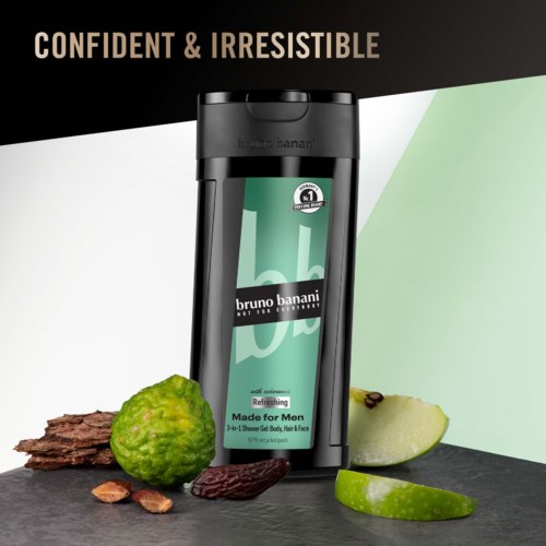 Een mannendoucheproduct met groene ingrediënten, omgeven door limoen, appel en natuurlijke elementen, benadrukt frisheid.