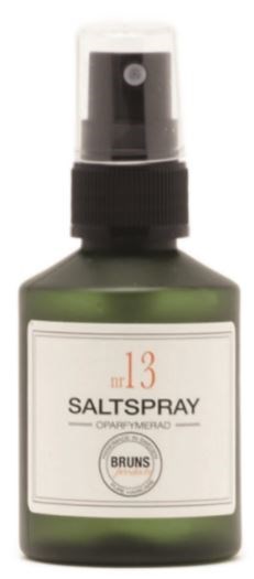 En liten grön flaska med sprayhätta märkta 'Salt Spray' och siffran 13 på.