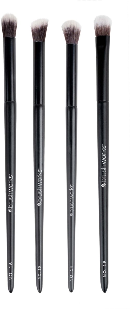 Four makeup brushes lined up on a white background, different sizes, with black handles and soft bristles.