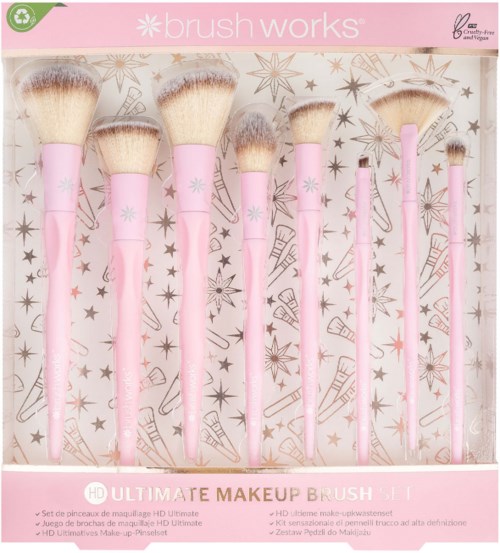 En serie med åtta rosa sminkborstar med fluffiga vita toppar, arrangerade i en rosa box med stjärnor och tårtdesigner.