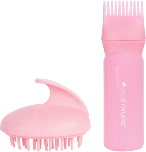 Pinkki sähköinen hiustenleikkuulaite, jossa on pyöreä lisävaruste ja kampa. Laite lukee "brush works".