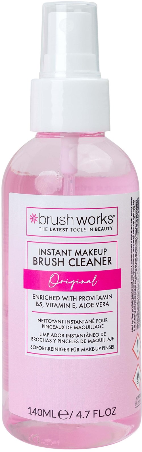 Pink bottle with a white spray top, labeled as a makeup brush cleaner, brand 'brush works' and 'instant makeup brush cleaner'.