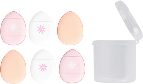 Six eggs, some cracked open, and a white container with a lid nearby, on a white surface.