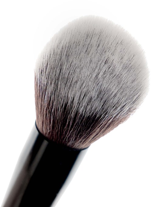 A makeup brush with black handle and soft, fluffy white and gray bristles.