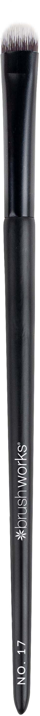 A makeup brush with a black handle and soft bristles, labeled 'Real Techniques' and '13'.