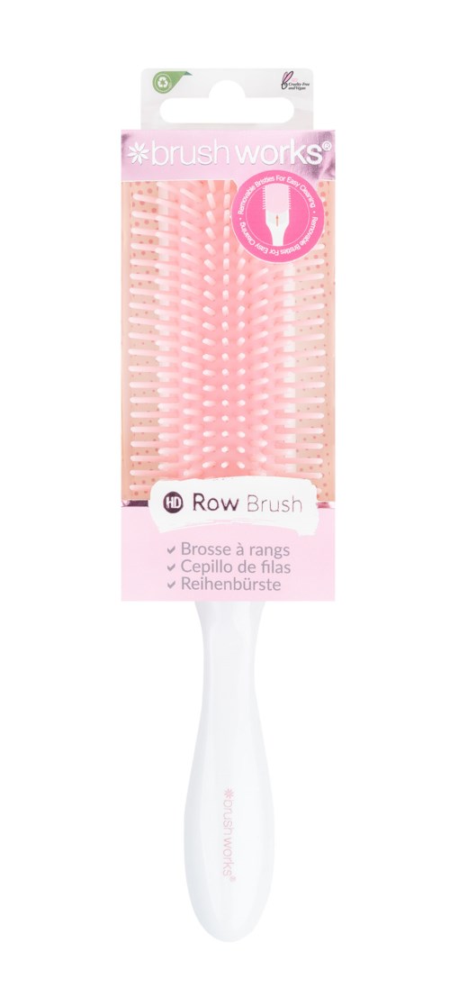 A white hairbrush with pink bristles, packaged in a clear plastic cover, labeled for gentle use and hair renewal.