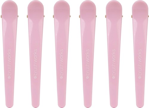 Six pink nail files are arranged in a row against a black background.