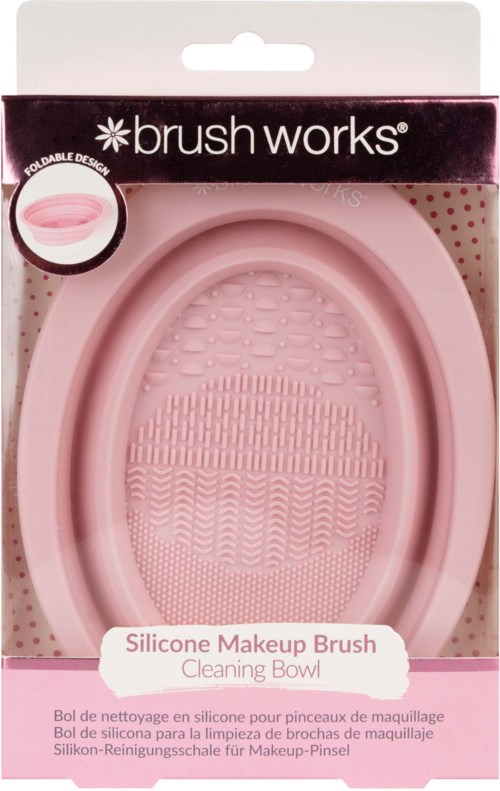 Roze siliconen make-upkwast schoonmaakkom/met met textuur, verpakt in een doos met 'brush works' label.