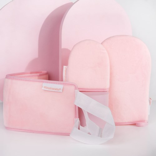 Soft pink set of storage pouches and boxes, some with zippers, arranged on a light background.