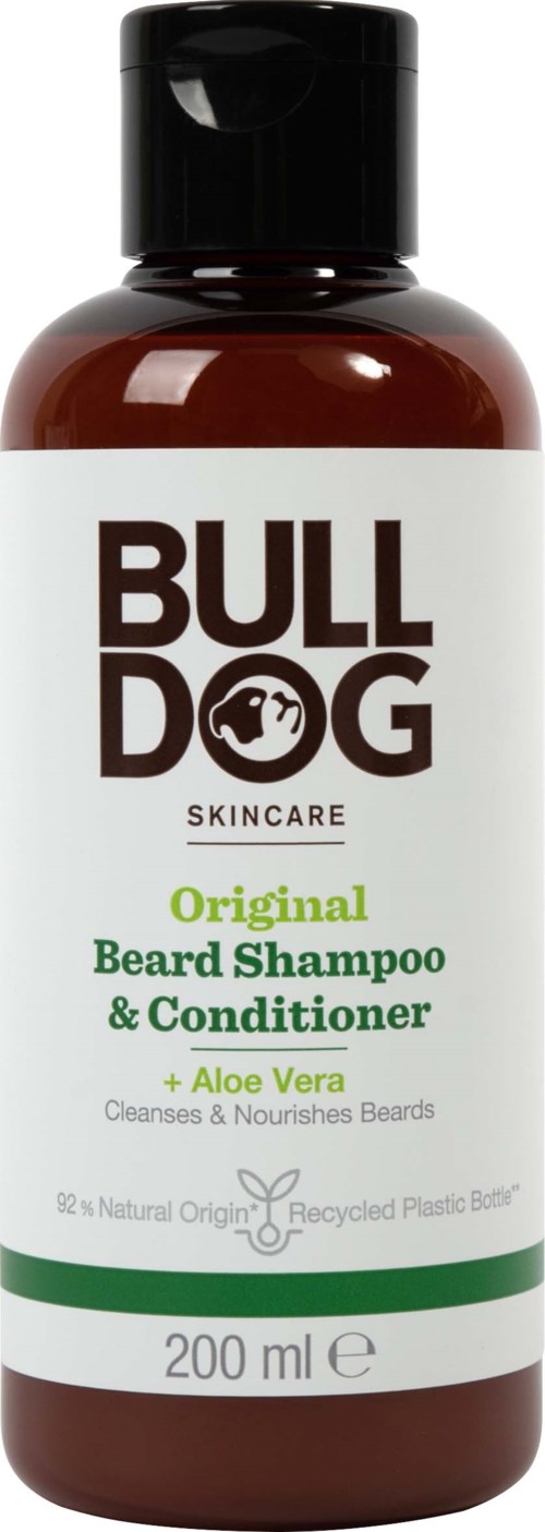 A brown bottle with a white label that has black, green, and small images, containing beard shampoo and conditioner.