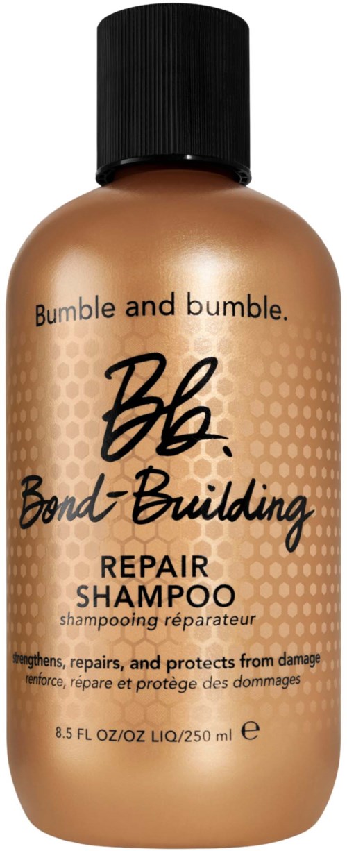 Bumble and bumble Bond-Building Repair Shampoo Flasche in Goldfarbe mit schwarzem Deckel.
