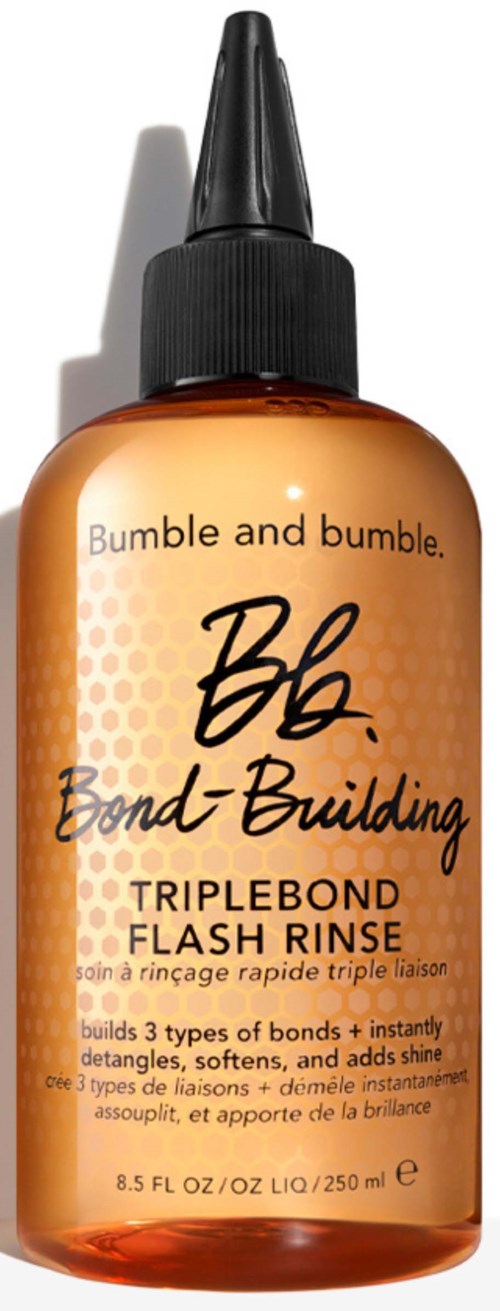 Flasche mit Bumble and Bumble BB Bond-Building Triple Bond Flash Rinse für Haare, mit schwarzem Deckel, orangefarbene Flasche und Text.