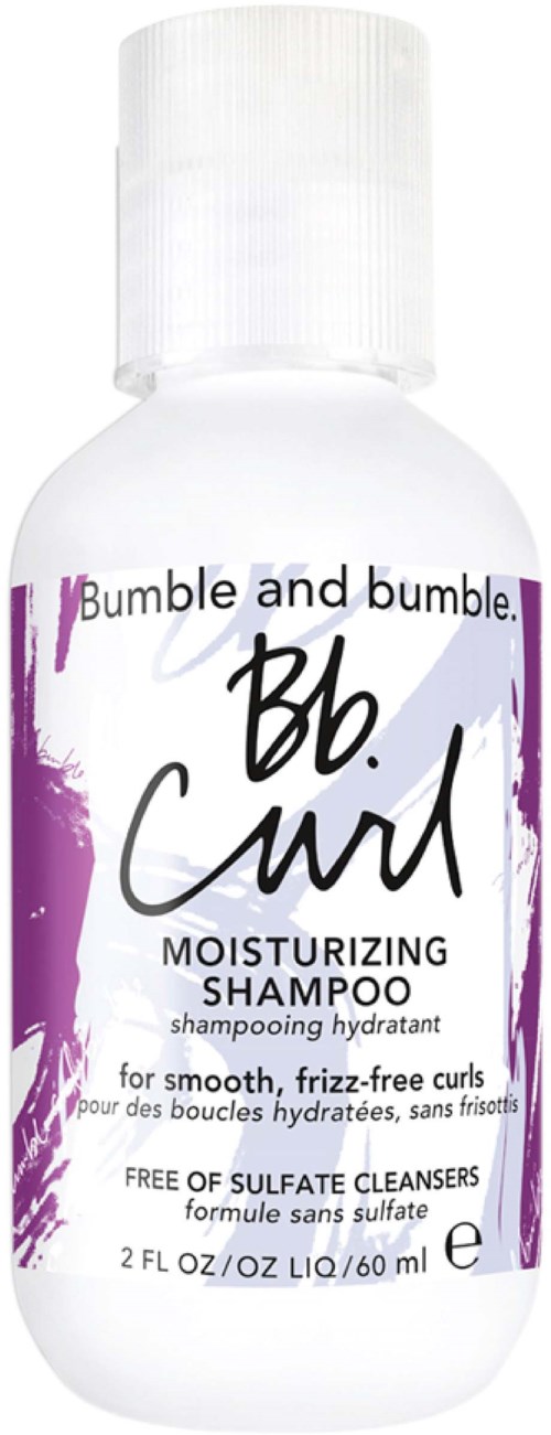 Eine weiße Flasche vom Bumble and bumble Bb. Curl pflegenden Shampoo mit lila und schwarzem Text, für lockiges Haar.
