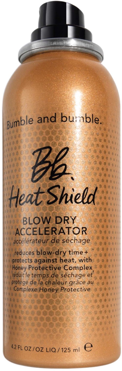 Eine goldene Flasche von Bumble and bumble Heat Shield Blow Dry Accelerator mit schwarzem Deckel und Produktdetails.