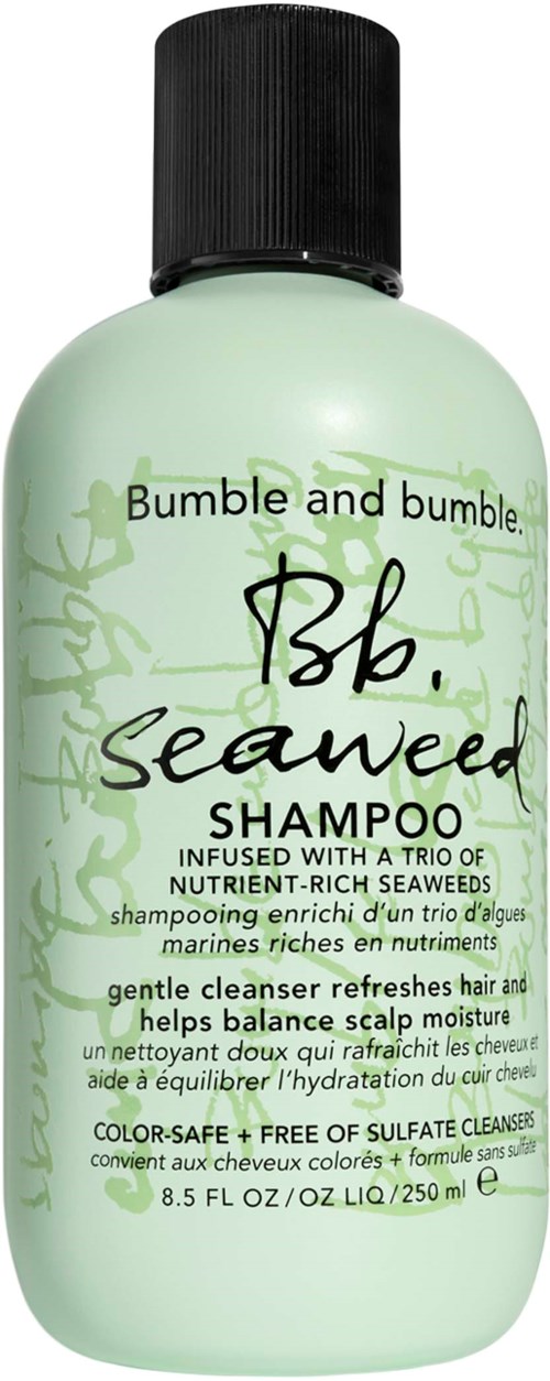 Dies ist eine hellgrüne Flasche mit Seealgen-Shampoo und schwarzem Verschluss. Es ist sanft und nährend für Haare.