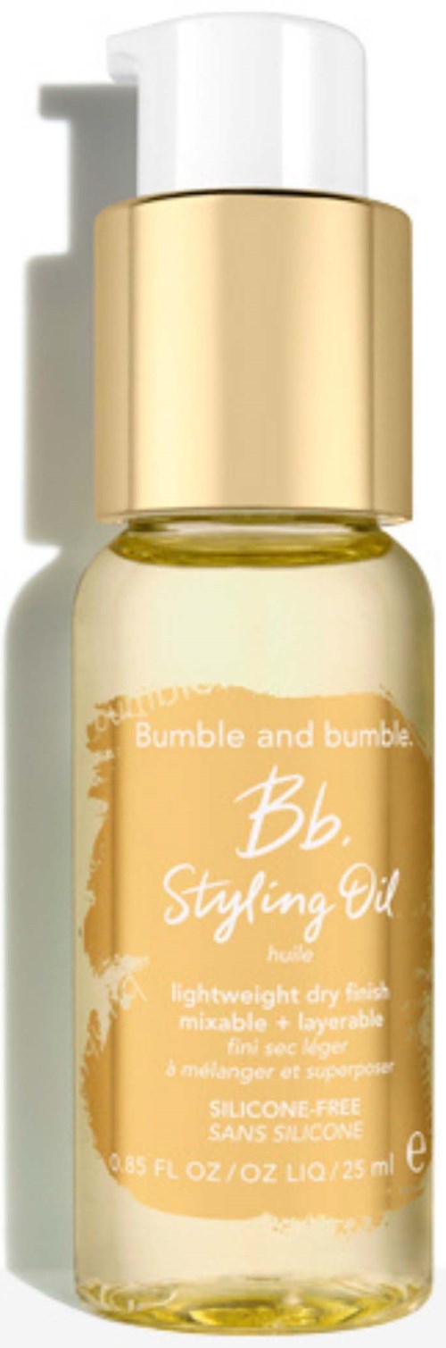 Small bottle of Bumble and Bumble styling oil, clear yellow liquid, gold cap, pump dispenser.