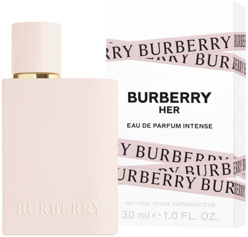 A soft pink perfume bottle with a white cap, next to a white box with pink and black text for Burberry Her.