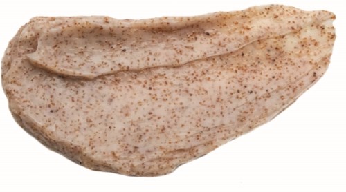 A piece of raw chicken meat with a light, speckled surface looks fresh.