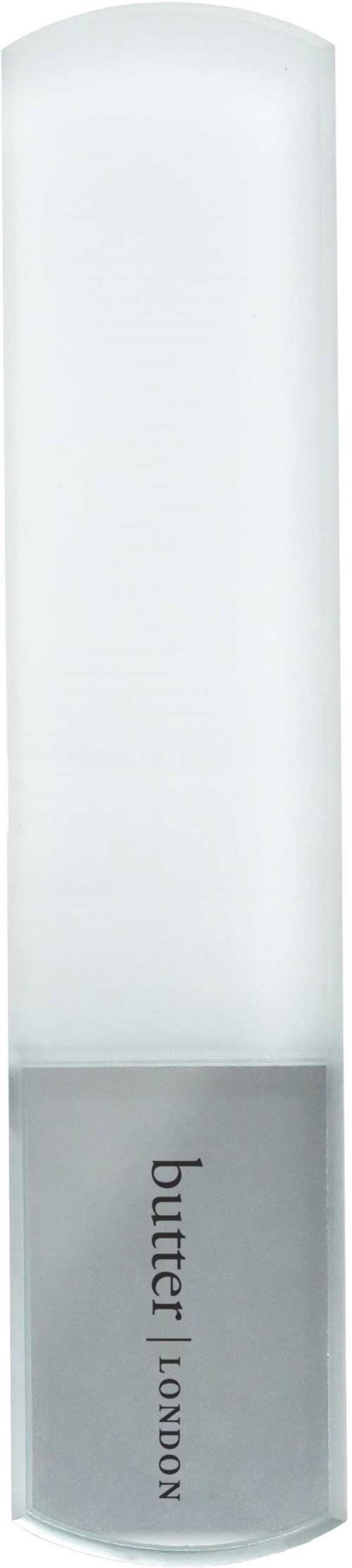 Long, white, cylindrical lamp with a bottom label saying "butter" and "LONDON."