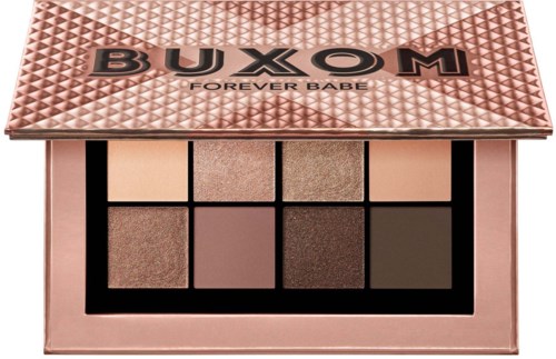 An eyeshadow palette with eight shades in a pink case, labeled BUXOM and Forever Babe.