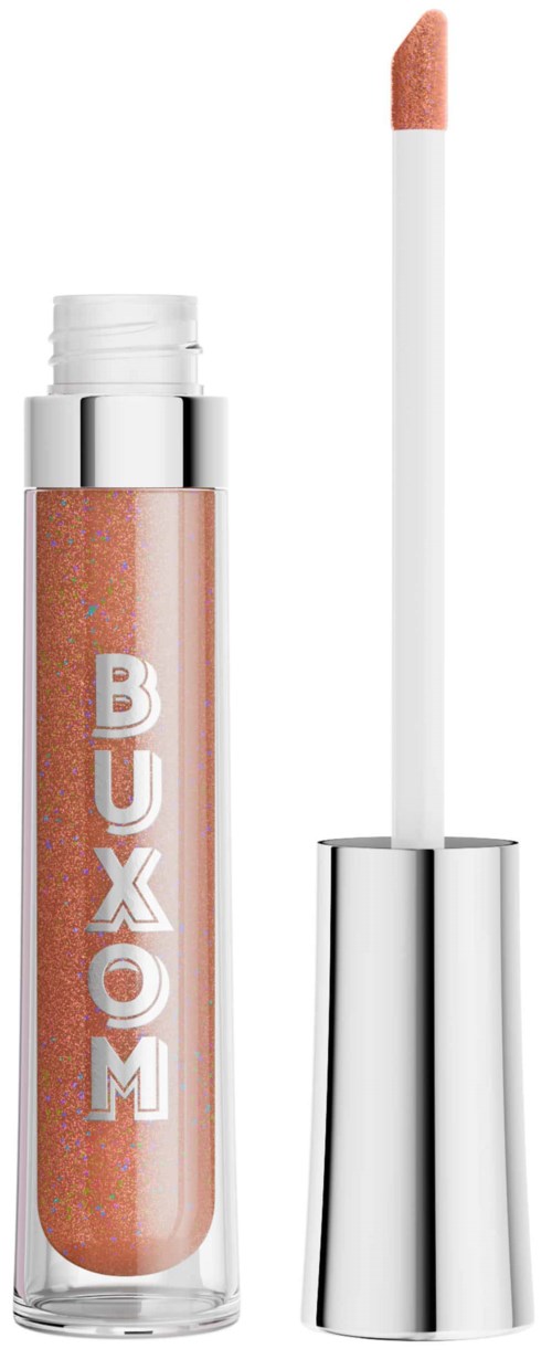 A glittery peach-colored lip gloss with a white applicator and silver cap. The brand name is BUXOM.