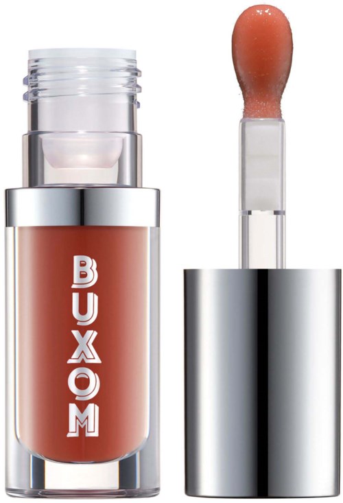 Buxom lip gloss tube with a doe-foot applicator, silver cap, and pinkish product inside.