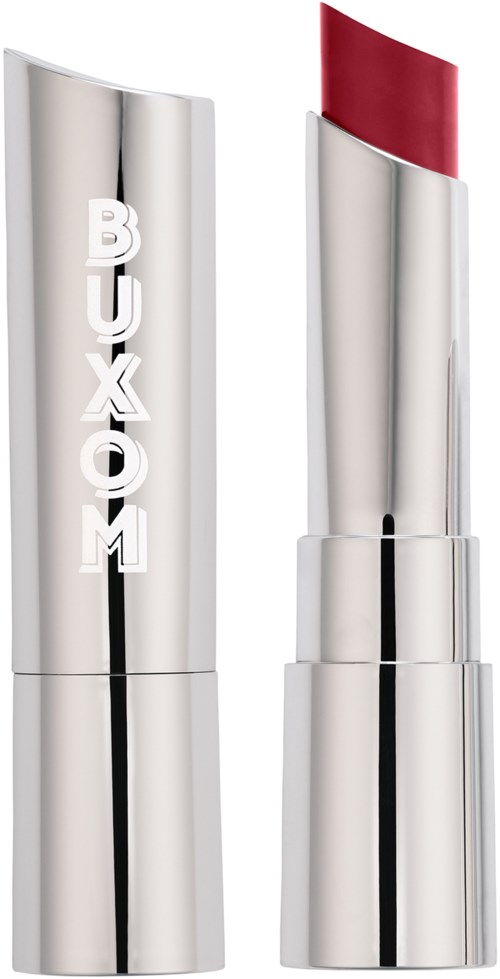 A silver lipstick case with the word 'BUXOM' and a red lipstick showing.