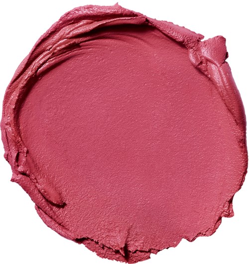 A pink makeup product in a circular shape with a smooth, creamy texture and some uneven edges.