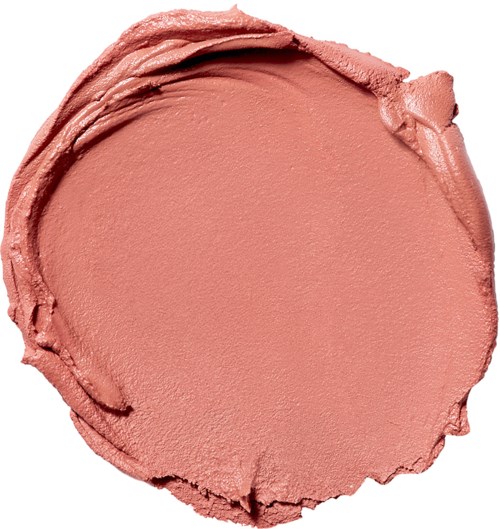 A round, pinkish makeup or lipstick product with smoothed edges and some textured areas.