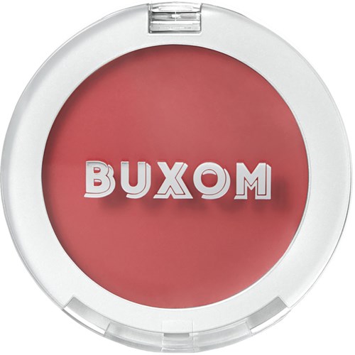 A round blush or makeup item with white borders and the word 'BUXOM' in the center.