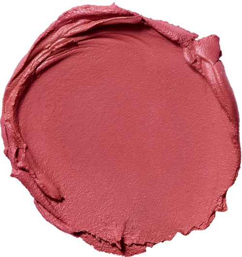 A pink, round dollop of makeup cream with uneven edges and a smooth, matte surface.
